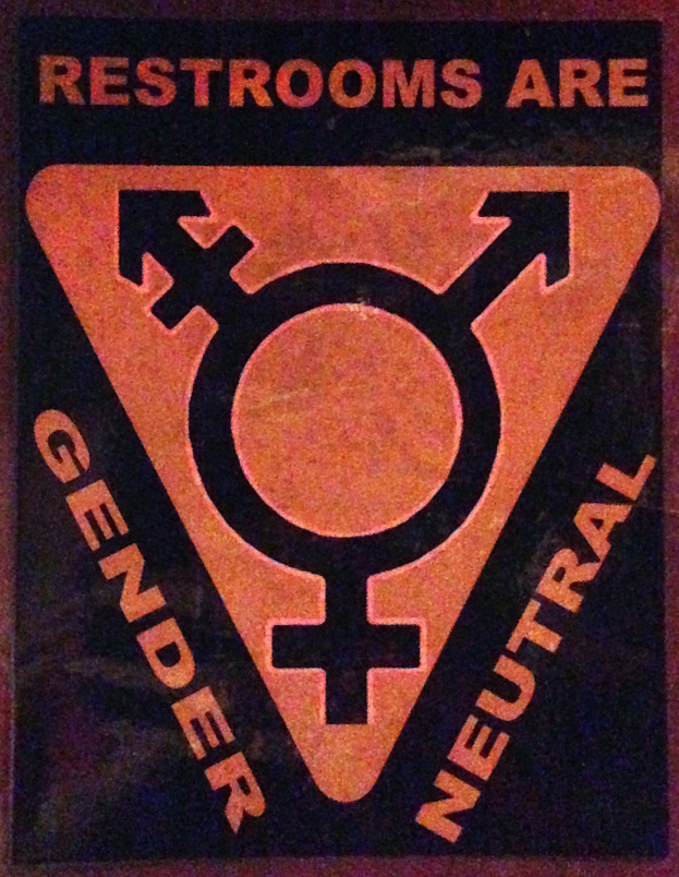 Ein Plakat mit der Aufschrift "Toiletten sind genderneutral" betont die Bedeutung von Geschlecht in Toiletten.