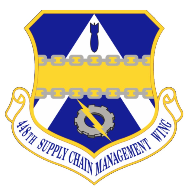 Logo des 48. Versorgungsgeschwader mit einem blauen Schild mit einem weißen Stern und einem weißen Banner mit der Aufschrift "Versorgungsgeschwader" in blau, alles innerhalb eines weißen Rahmens, mit der Schrift "48. Versorgungsgeschwader" in fetter schwarzer Schrift.